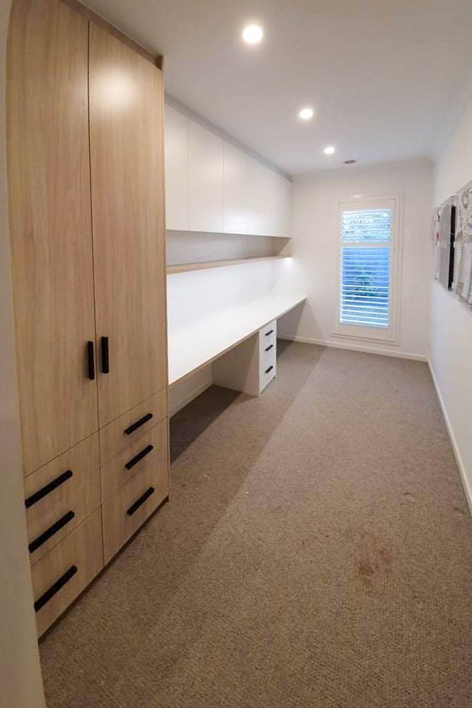 Built-in study desk with overhead storage