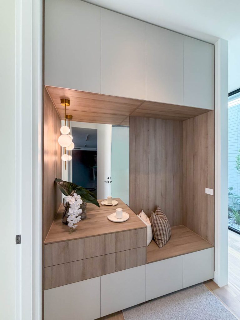 Laundry joinery with open shelving and bench space