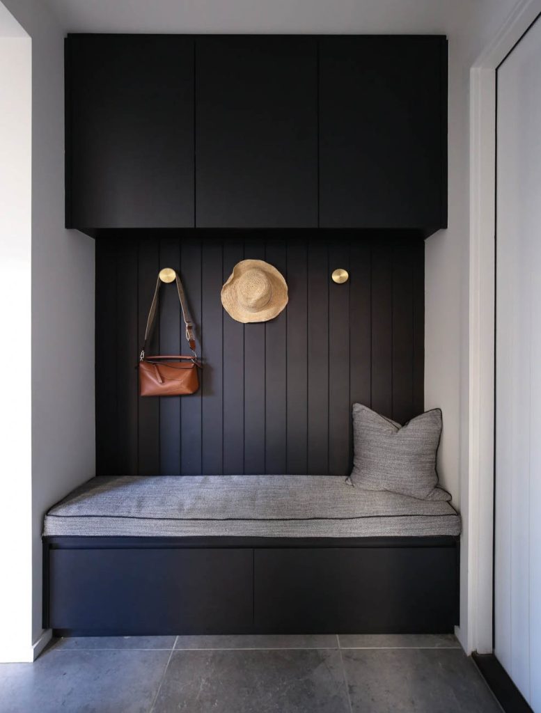 Laundry joinery with open shelving and bench space