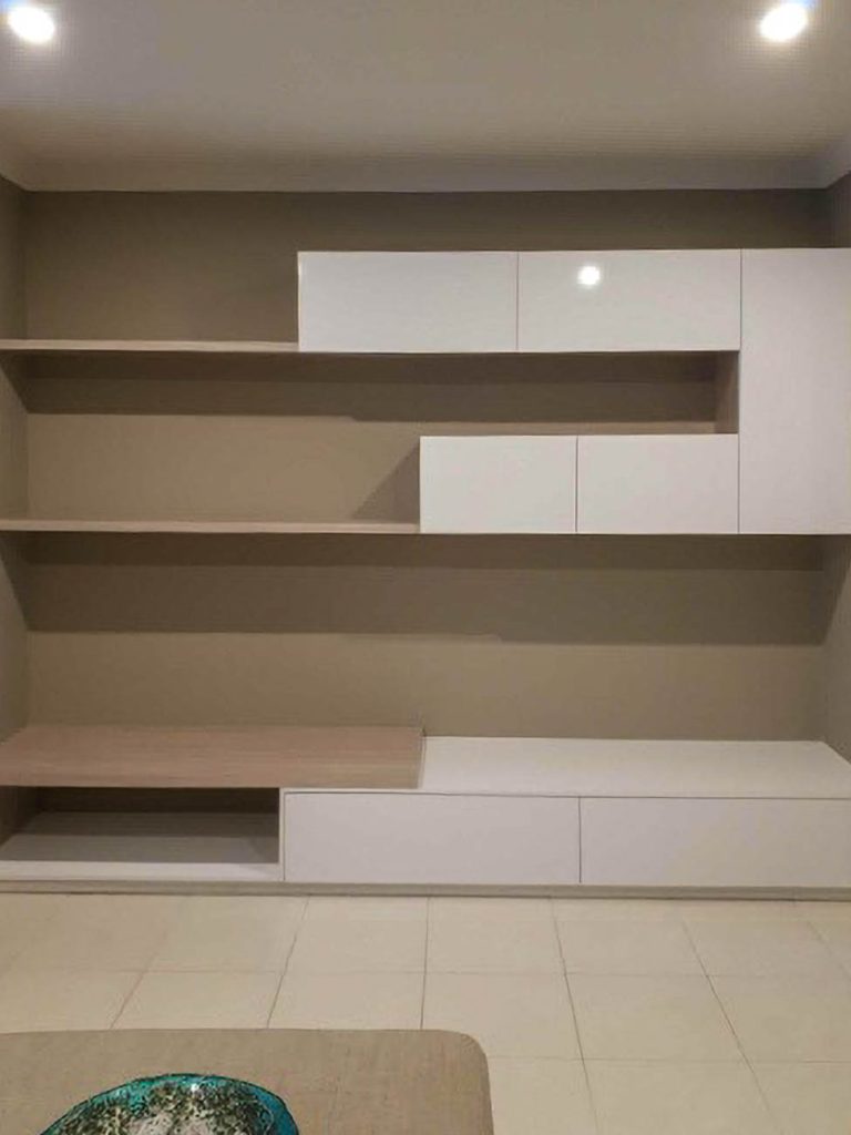 Living room cabinetry with floating shelves
