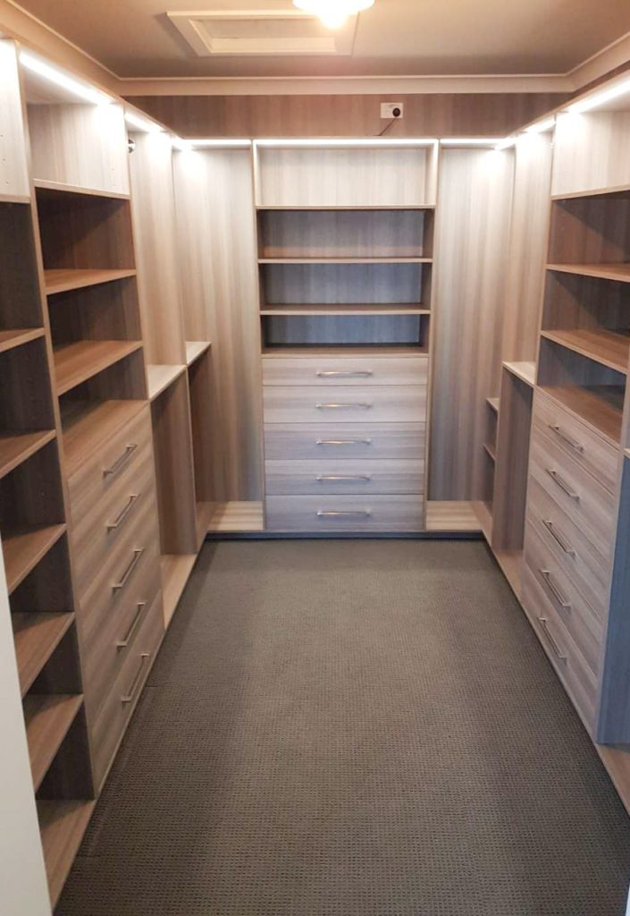 Bespoke walk-in wardrobe with adjustable shelving