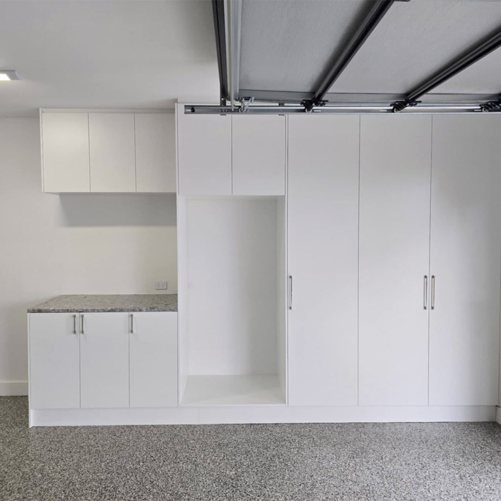 Custom garage storage with floor-to-ceiling cabinets
